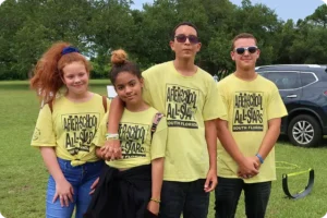 Four Kids wearing yellow ASAS shirts