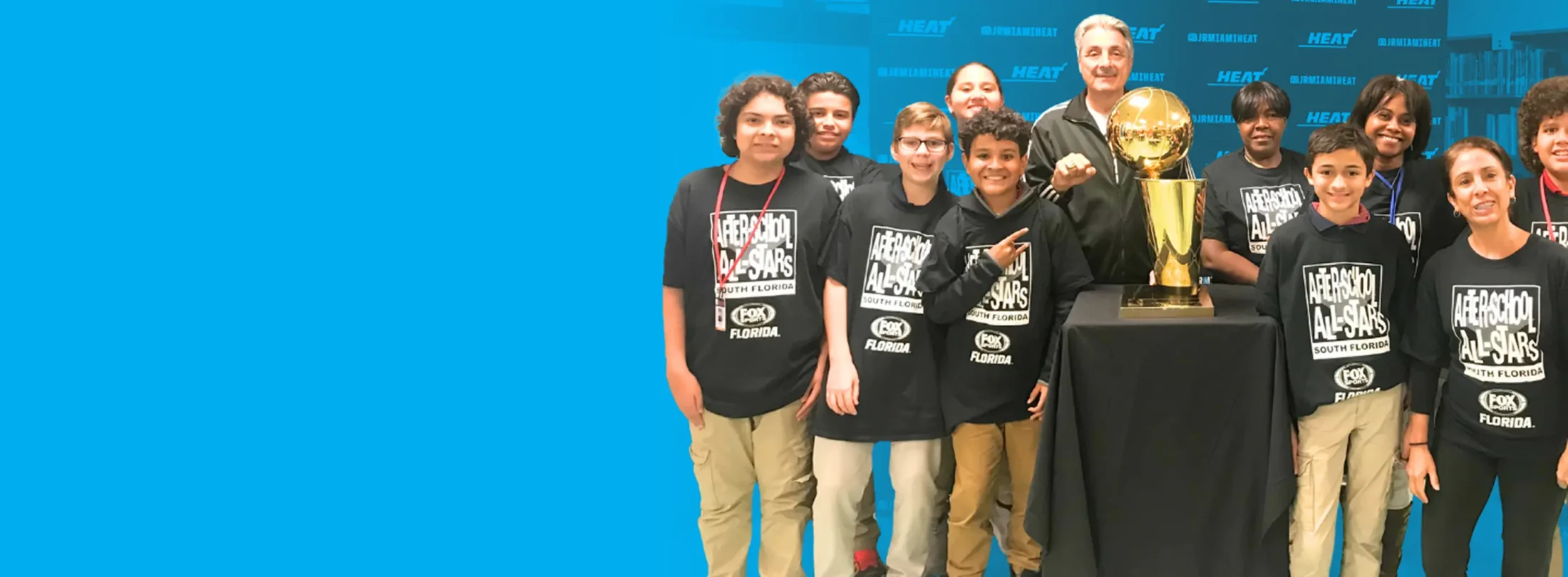 Banner image of After School All-Stars group photo with Trophy