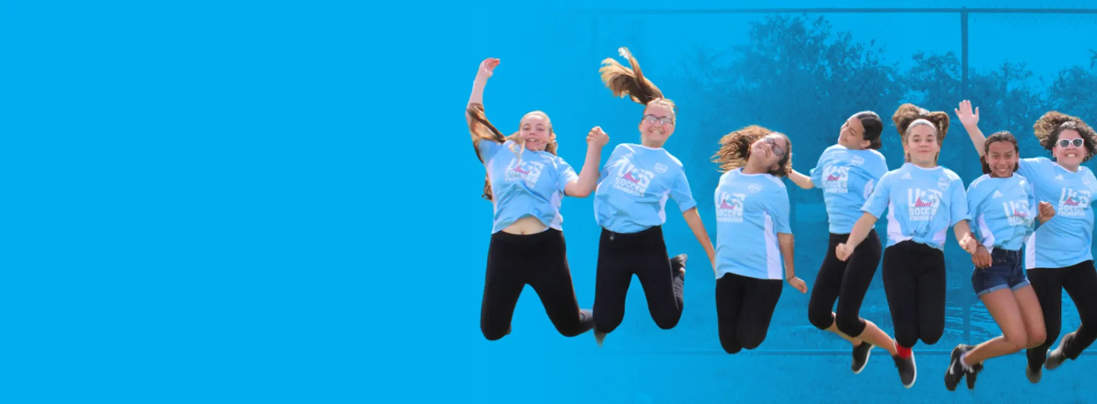 Testimonials Banner with a group of girls jumping in the air