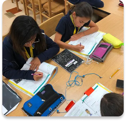 Two girls doing homework together