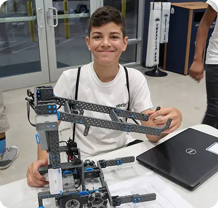Young boy with mechanical project
