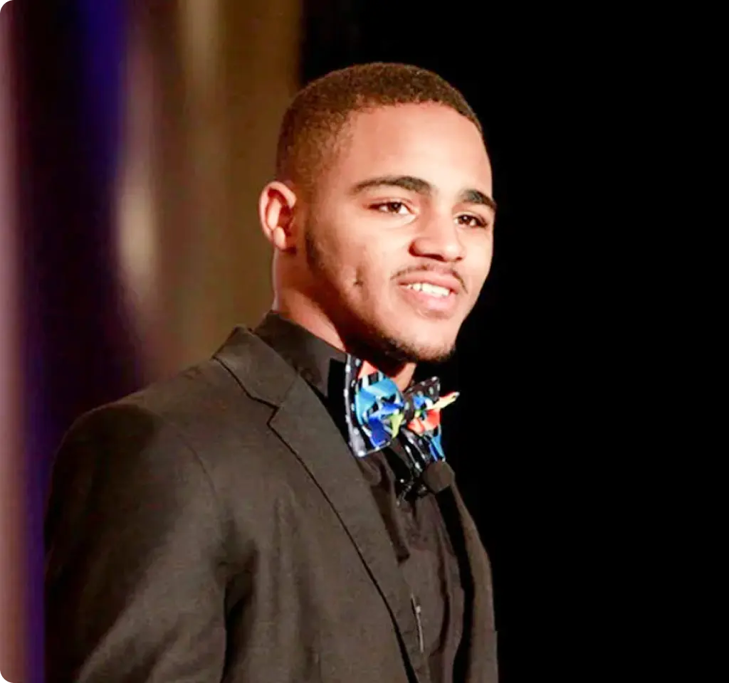 Teenage boy wearing a nice black suit