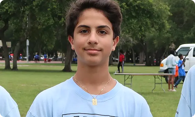 Teenage boy wearing after school all stars shirt